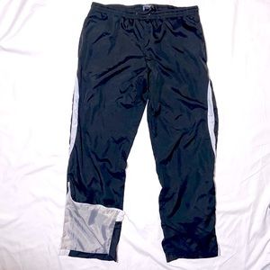 Wind Pants by GTM Sportswear. Size Medium. Black with White Accents on the sides